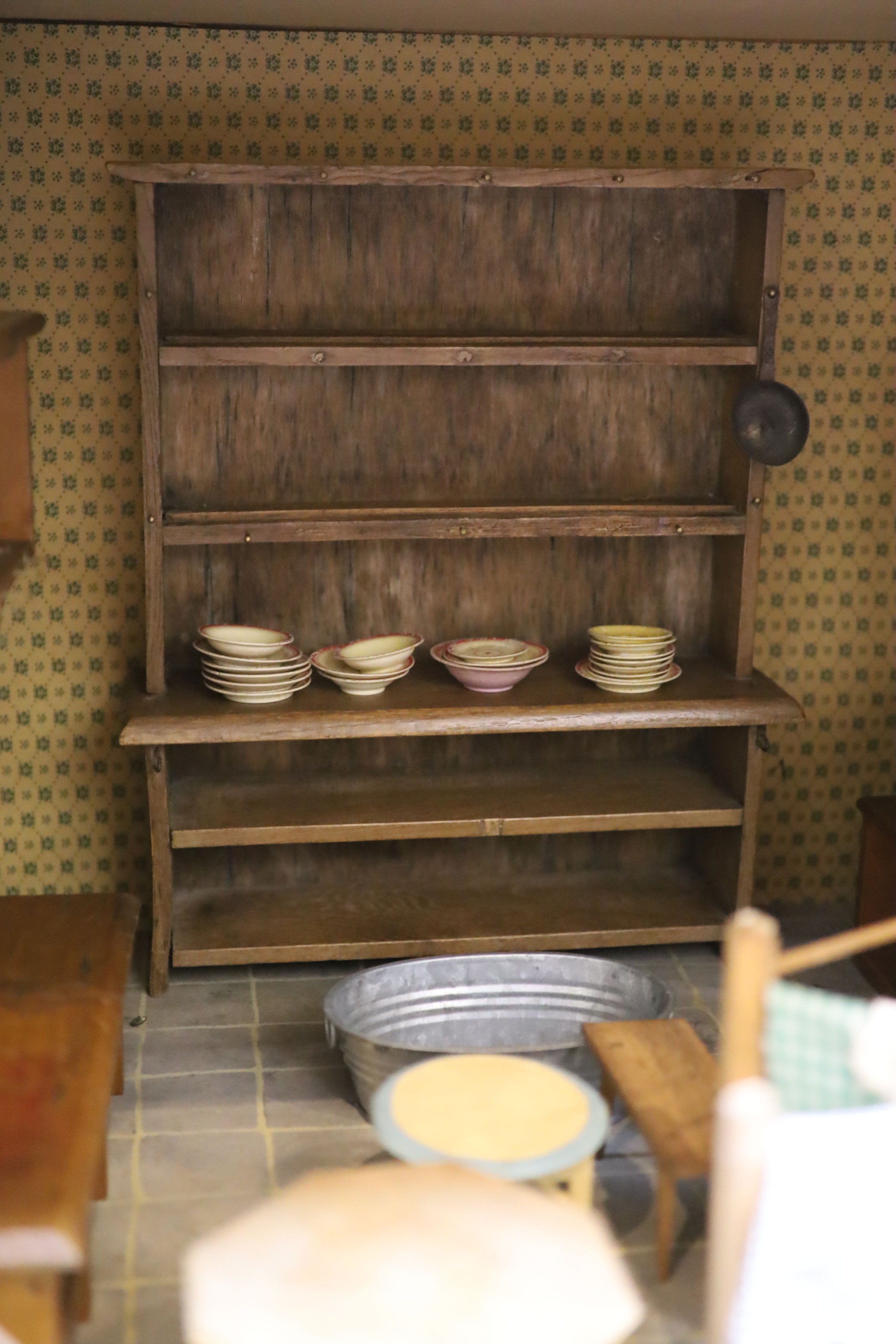 An unusually large painted pine doll's house, modelled upon a Victorian lodge house, Estate Carpenter made, Lake District width 198cm height 156cm